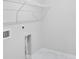 Laundry area featuring wire shelving, tile floors, and hookups for washer and dryer at 464 Village Ln, Fairburn, GA 30213