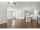 Open-concept living space featuring a modern kitchen with an island and gray cabinets at 464 Village Ln, Fairburn, GA 30213