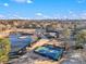 Beautiful aerial view with a lake, golf course, tennis court, and city skyline at 170 Elysian Nw Way, Atlanta, GA 30327