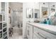 Modern bathroom with marble countertop, tiled walls, and built-in storage at 170 Elysian Nw Way, Atlanta, GA 30327