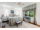 Comfortable bedroom with large windows, hardwood floors, and neutral decor at 170 Elysian Nw Way, Atlanta, GA 30327