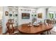 Open dining room with wood table, built-in shelving, and natural lighting creates a warm, inviting atmosphere at 170 Elysian Nw Way, Atlanta, GA 30327