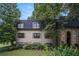 Charming townhome with a manicured lawn and mature trees provides natural shade and curb appeal at 170 Elysian Nw Way, Atlanta, GA 30327