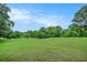 Scenic view of a well-maintained golf course with lush green grass and mature trees in the background at 170 Elysian Nw Way, Atlanta, GA 30327