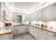Bright kitchen with granite countertops, white appliances, and ample cabinet space at 170 Elysian Nw Way, Atlanta, GA 30327