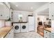 Updated kitchen including a laundry area with modern washer and dryer units at 170 Elysian Nw Way, Atlanta, GA 30327