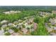 An aerial view of a residential neighborhood, surrounded by trees and showing well-maintained lawns and landscaping at 1888 Sever Creek Cir, Lawrenceville, GA 30043
