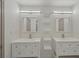 Modern bathroom featuring double sinks, floating shelves, and sleek mirrors at 1888 Sever Creek Cir, Lawrenceville, GA 30043