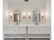 Elegant bathroom features a double vanity with stylish mirrors and lighting at 1888 Sever Creek Cir, Lawrenceville, GA 30043