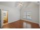 Bedroom with hardwood floors, a window, and ensuite bathroom at 1888 Sever Creek Cir, Lawrenceville, GA 30043