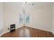 Bright bedroom with hardwood floors, two windows, and neutral decor at 1888 Sever Creek Cir, Lawrenceville, GA 30043