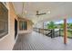 Covered deck with ceiling fan, recessed lights, and an iron railing overlooking the backyard at 1888 Sever Creek Cir, Lawrenceville, GA 30043