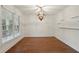 Bright dining room with hardwood floors, pendant lighting, and a large window at 1888 Sever Creek Cir, Lawrenceville, GA 30043