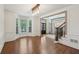Inviting dining room with hardwood floors, large windows and elegant lighting fixtures at 1888 Sever Creek Cir, Lawrenceville, GA 30043