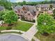 Well-manicured front yard with lush green lawn, mature trees, and attractive landscaping enhance curb appeal at 1888 Sever Creek Cir, Lawrenceville, GA 30043