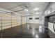 Spacious garage featuring an epoxy floor, storage cabinets, and windows at 1888 Sever Creek Cir, Lawrenceville, GA 30043