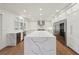 Bright kitchen featuring a large island with quartz countertop and stainless steel appliances at 1888 Sever Creek Cir, Lawrenceville, GA 30043