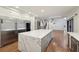 Gourmet kitchen flowing into a Gathering room, featuring a large island with quartz countertop at 1888 Sever Creek Cir, Lawrenceville, GA 30043