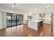 Modern kitchen and dining area with quartz countertops, stainless steel appliances, and deck access at 1888 Sever Creek Cir, Lawrenceville, GA 30043