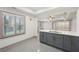 Open kitchen design with granite island seating and view to the bright and airy living space at 1888 Sever Creek Cir, Lawrenceville, GA 30043