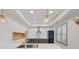 Contemporary kitchen features stainless appliances, stylish pendant lighting, and gray cabinetry at 1888 Sever Creek Cir, Lawrenceville, GA 30043