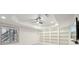 Bright living room features custom built-ins and modern ceiling fan with recessed lighting at 1888 Sever Creek Cir, Lawrenceville, GA 30043