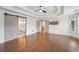 Main bedroom showcasing wood floors, coffered ceilings and barn door to the ensuite bath at 1888 Sever Creek Cir, Lawrenceville, GA 30043