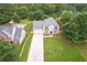 An aerial view captures this lovely home with a large yard and a pool in the neighborhood at 1976 Glen Echo Dr, Decatur, GA 30032