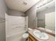 Bathroom featuring neutral walls, tile flooring, a shower-tub combo and a single vanity sink at 1976 Glen Echo Dr, Decatur, GA 30032