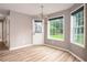 Bright dining area with wood floors, chandelier, and back door at 1976 Glen Echo Dr, Decatur, GA 30032