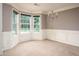 Bright dining room featuring neutral walls, large windows, and elegant chandelier at 1976 Glen Echo Dr, Decatur, GA 30032