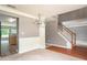 Dining area featuring hardwood floors, chandelier, and stairs at 1976 Glen Echo Dr, Decatur, GA 30032