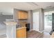 View of kitchen with stainless sink and view of dining area at 1976 Glen Echo Dr, Decatur, GA 30032