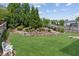 Spacious backyard with lush lawn, garden bed, and sitting bench at 4207 N Carver Dr, Atlanta, GA 30360