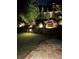 Backyard at night featuring landscape lighting and a cascading waterfall at 4207 N Carver Dr, Atlanta, GA 30360