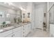 Bathroom with double granite vanity, framed mirror and glass enclosed shower at 4207 N Carver Dr, Atlanta, GA 30360