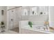 Luxurious bathroom with glass shower, garden tub, and stylish tile at 4207 N Carver Dr, Atlanta, GA 30360