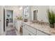 Bright bathroom featuring double vanities with granite countertops and modern fixtures at 4207 N Carver Dr, Atlanta, GA 30360
