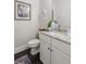 Elegant half-bathroom featuring granite countertops and dark wood flooring at 4207 N Carver Dr, Atlanta, GA 30360