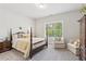 Cozy bedroom with a four-poster bed, neutral tones, and a bright window at 4207 N Carver Dr, Atlanta, GA 30360