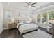 Tranquil main bedroom with tray ceiling, fan, large window and decorative accents at 4207 N Carver Dr, Atlanta, GA 30360
