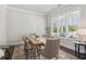 Bright dining room with large windows and a neutral color palette at 4207 N Carver Dr, Atlanta, GA 30360