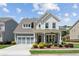 Charming two-story home with a welcoming front porch and beautifully landscaped front yard at 4207 N Carver Dr, Atlanta, GA 30360