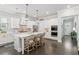 Bright kitchen with white cabinets, stainless appliances, large island and decorative pendant lighting at 4207 N Carver Dr, Atlanta, GA 30360