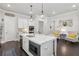 Gourmet kitchen with large center island, stainless appliances, and sleek quartz countertops at 4207 N Carver Dr, Atlanta, GA 30360