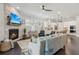 Open-concept living room with stone fireplace and view of the kitchen, perfect for entertaining at 4207 N Carver Dr, Atlanta, GA 30360