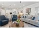 Spacious living room with hardwood floors, comfortable seating, and an open view to the kitchen at 4207 N Carver Dr, Atlanta, GA 30360