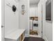 Inviting mudroom with built-in bench, storage, and view into laundry room at 4207 N Carver Dr, Atlanta, GA 30360