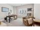 Well-lit home office featuring an executive desk and comfortable armchair at 4207 N Carver Dr, Atlanta, GA 30360