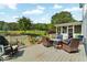 Expansive deck offering outdoor seating, grill, and views of the beautifully landscaped yard at 5335 Davenport Mnr, Cumming, GA 30041